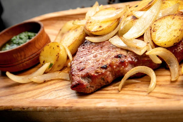 Fried Steak Served Potatoes Onions Dark Background — Stock Photo, Image