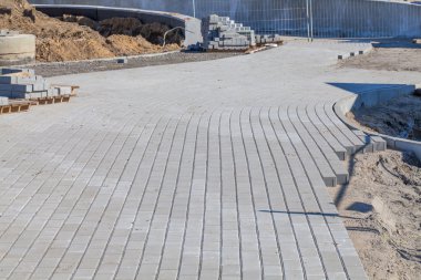 Construction of sidewalk with cobblestones