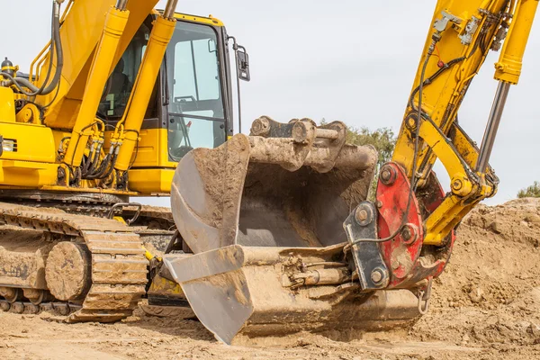 Construction site - excavator with removable bucket — Stock Photo, Image