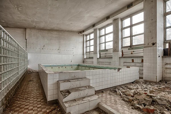 Swimming pool in a ruined building — Stock Photo, Image