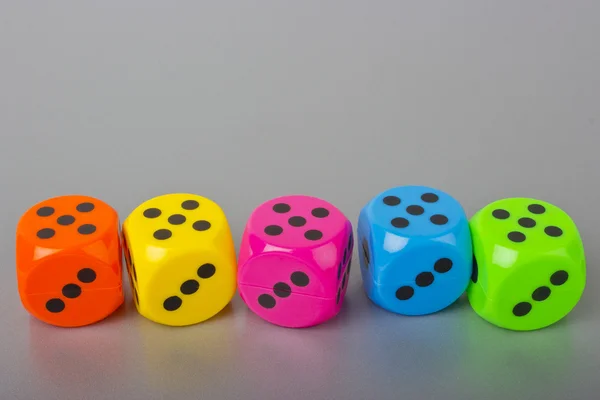 Dices on the gray background — Stock Photo, Image