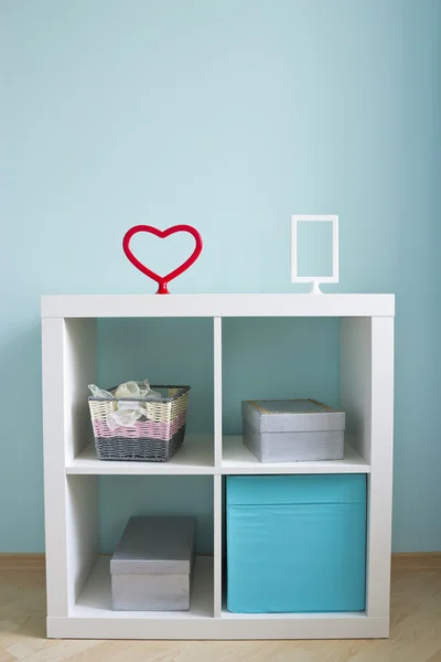 Beautiful white shelves with different home related objects — Stock Photo, Image