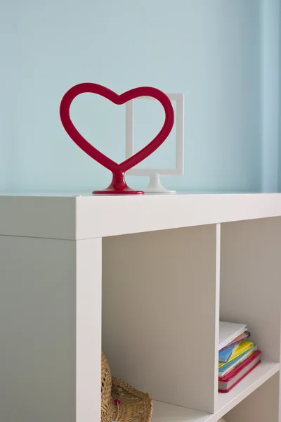 Frames on the beautiful white shelves — Stock Photo, Image