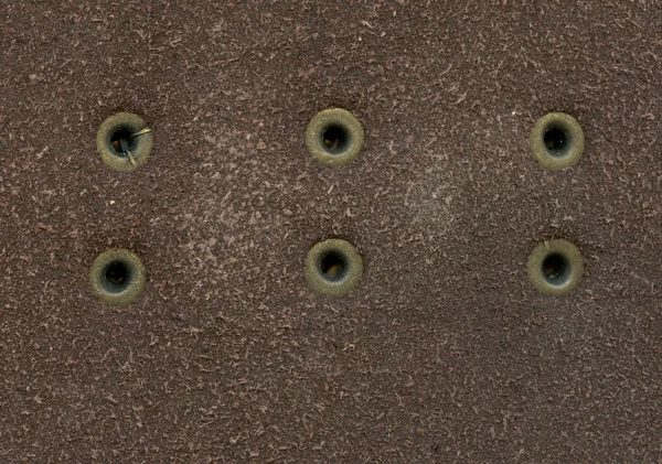 Close-up of metal rivets on leather background — Stock Photo, Image