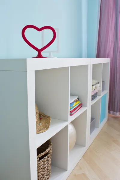 Beautiful white shelves with different home related objects — Stock Photo, Image