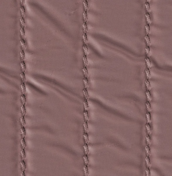 Hnědá textilní textury closeup, steh — Stock fotografie