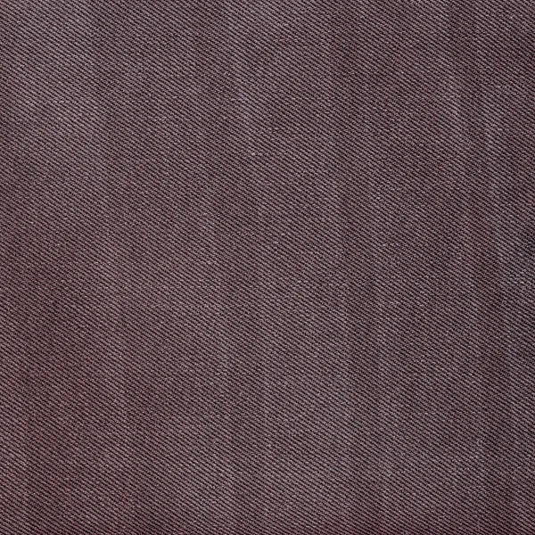 Текстиль коричневых джинсов — стоковое фото