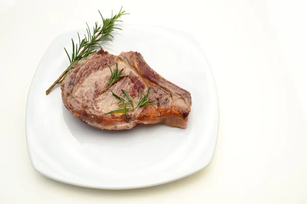 Beefsteak on the white plate — Stock Photo, Image