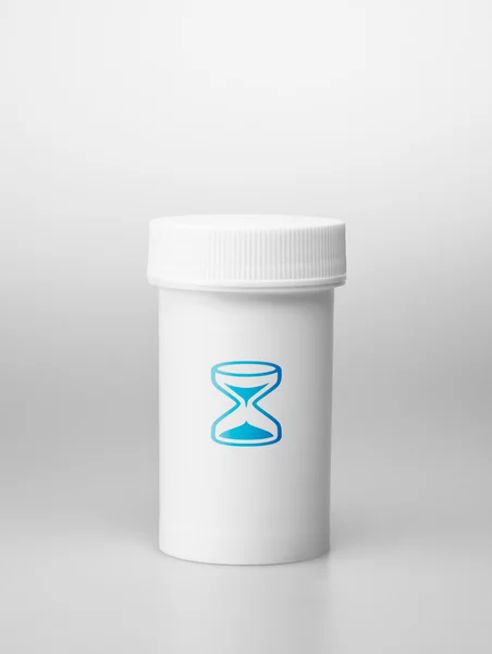 Small white medecine bottle — Stock Photo, Image