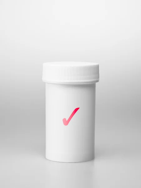 Small white medecine bottle — Stock Photo, Image