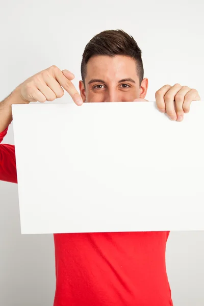 Young man holding a white board Stock Picture