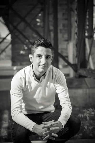 Portrait of a young man smiling outside Stock Photo