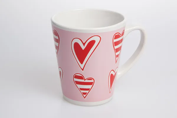 White and pink cup with red heart — Stock Photo, Image