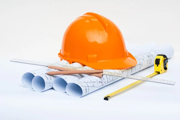 Rolls of architectural projects and construction tools — Stock Photo, Image