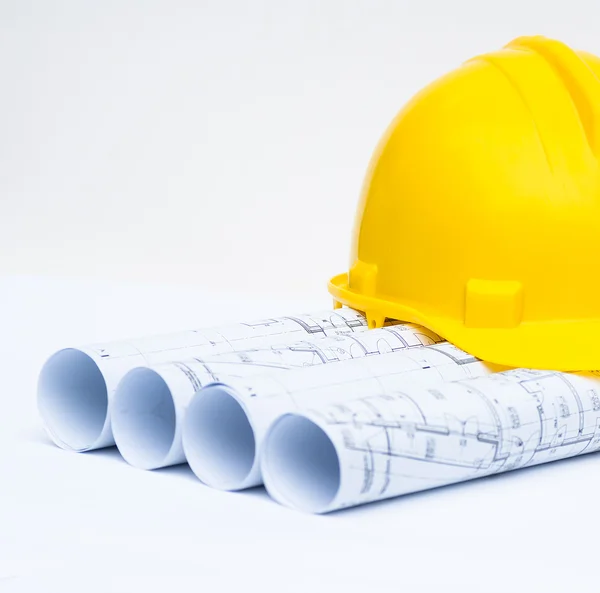 Rolls of architectural projects and construction tools — Stock Photo, Image