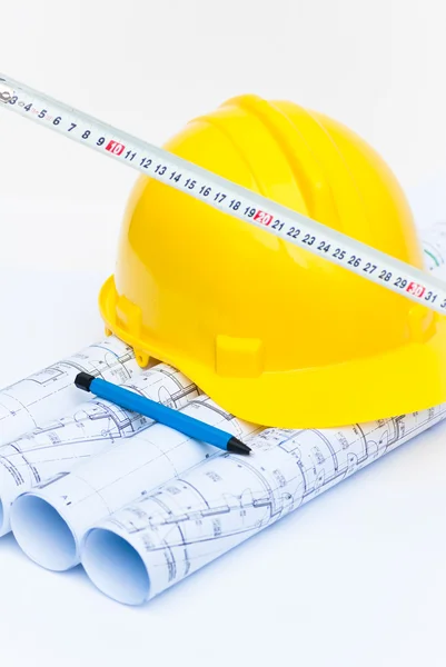 Construction helmet and architectural plans — Stock Photo, Image