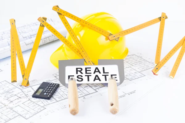 Construction tools with metric folding ruler and architectural drawings of the modern house — Stock Photo, Image