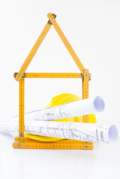 Construction tools with metric folding ruler and architectural drawings of the modern house — Stock Photo, Image