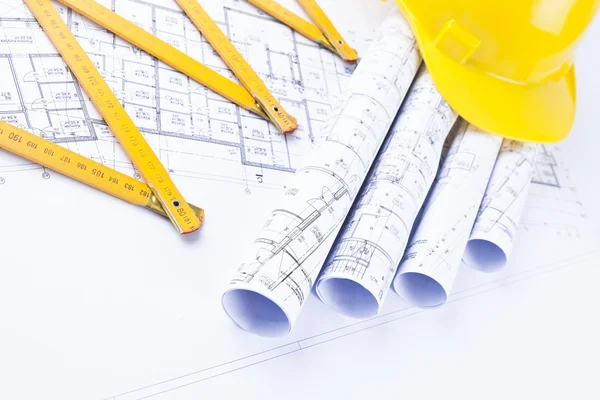 Architect rolls and construction tools — Stock Photo, Image