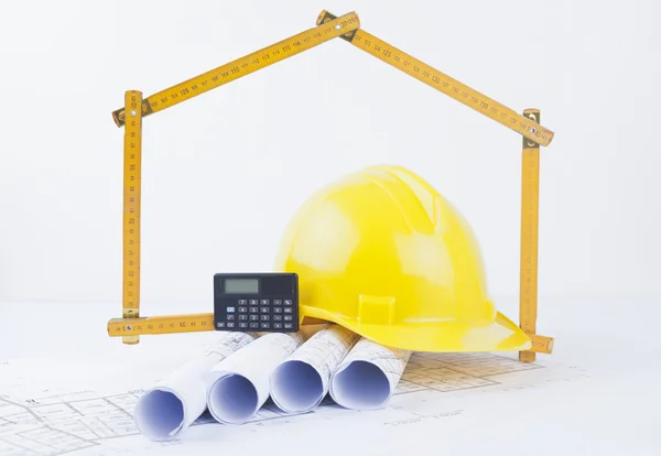 Construction tools with metric folding ruler and architectural drawings of the modern house — Stock Photo, Image