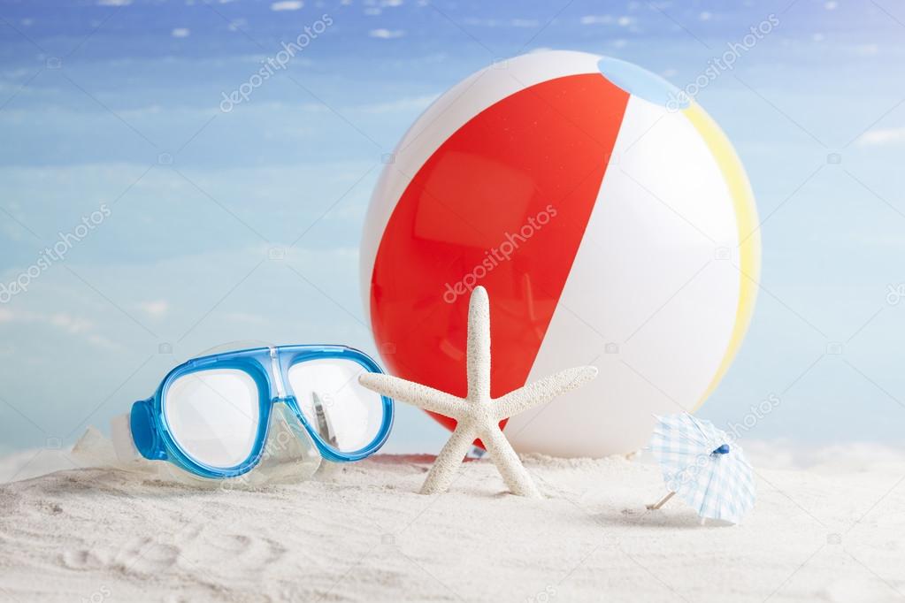Beach accessories with beach ball, sun glasses and starfish