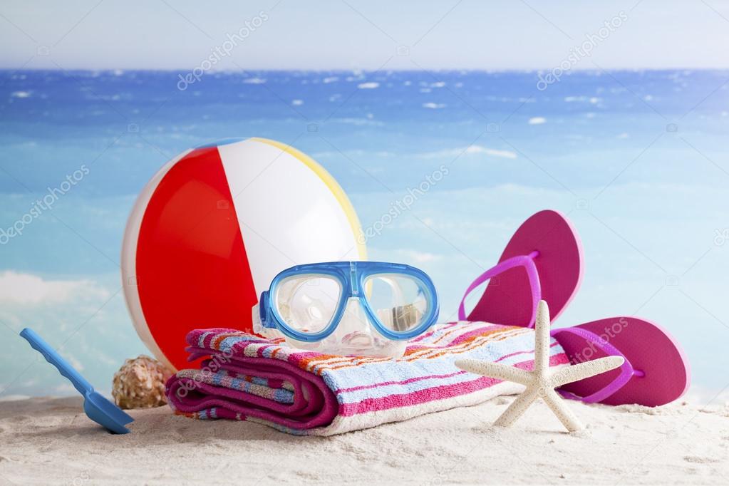 Beach accessories with beach ball, sun glasses and starfish