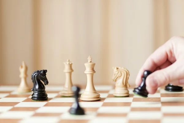 Moving chess pieces on chessboard — Stock Photo, Image