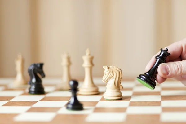 Moving chess pieces on chessboard — Stock Photo, Image