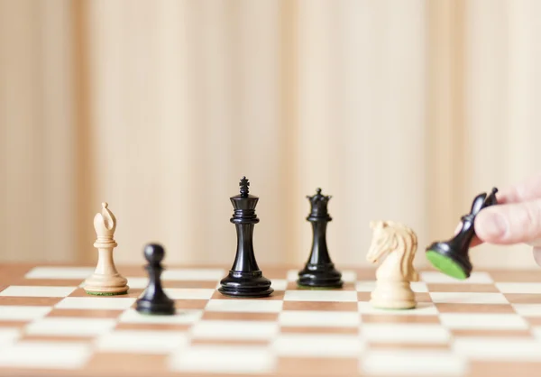 Moving chess pieces on chessboard — Stock Photo, Image
