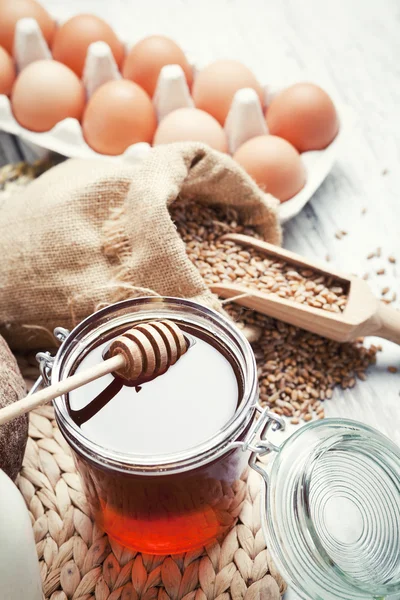 Ingredients for cooking, eggs, honey, bread, flour and milk — Stock Photo, Image