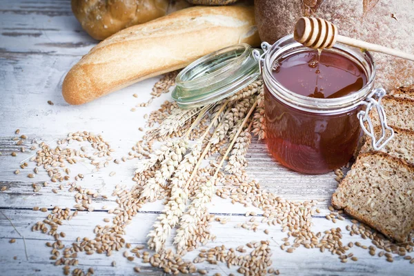 Ingredients for cooking, eggs, honey, bread, flour and milk — Stock Photo, Image