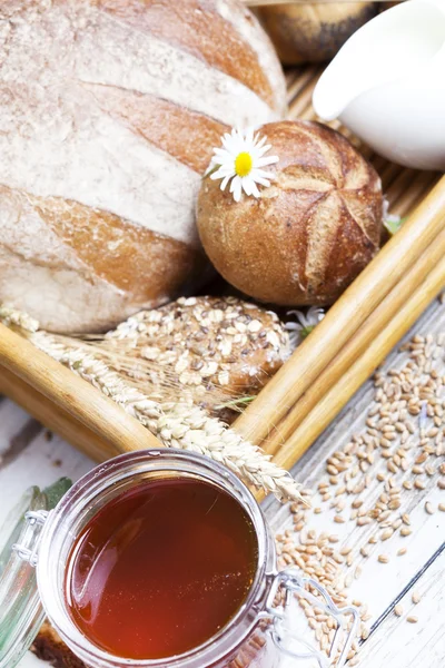 Ingredients for cooking, eggs, honey, bread, flour and milk — Stock Photo, Image