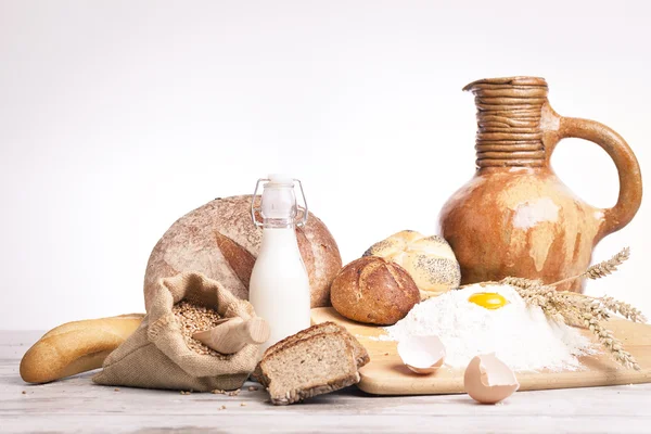 Vintage jug, bread and  seeds,isolated — Stock Photo, Image