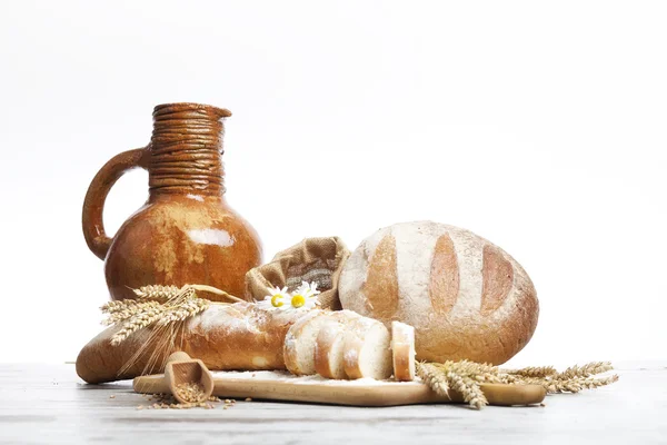 Vintage jug, bread and  seeds,isolated — Stock Photo, Image