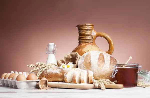 Vintage jug, bread and  seeds,isolated — Stock Photo, Image