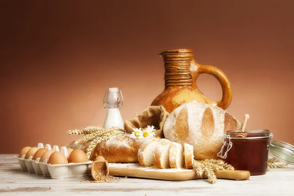 Vintage jug, bread and  seeds,isolated Stock Picture