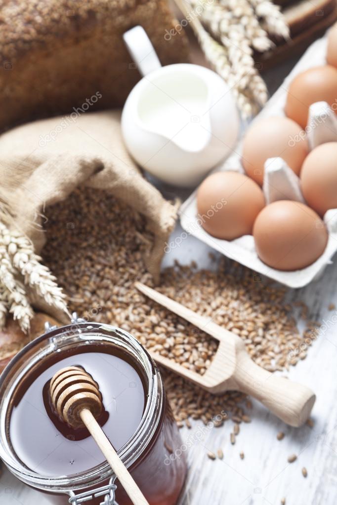 Ingredients for cooking, eggs, honey, bread, flour and milk