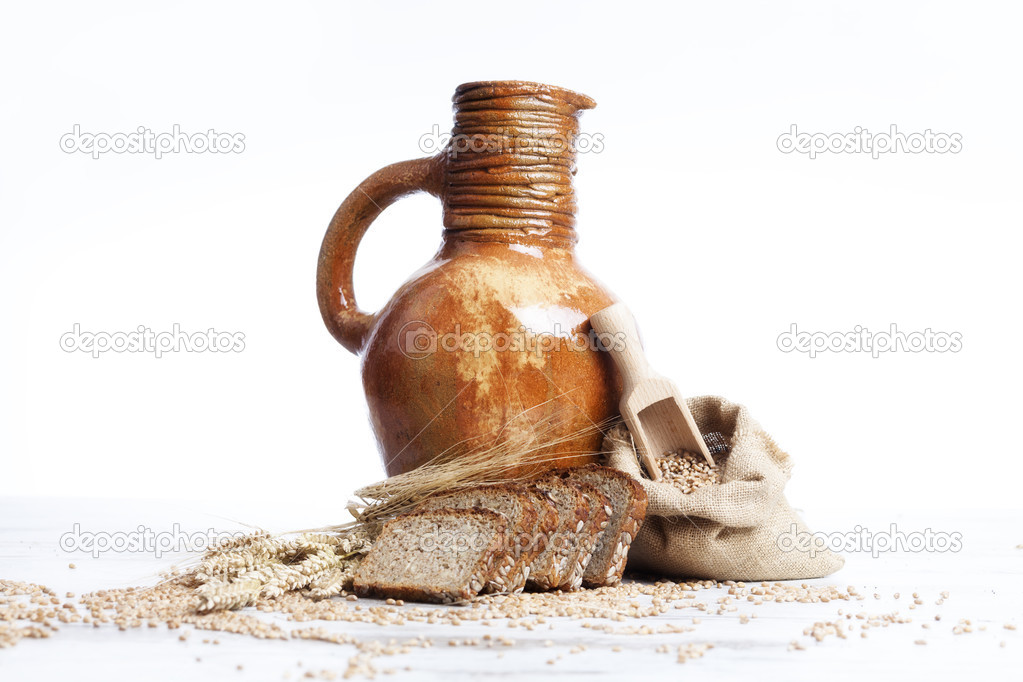 Vintage jug, bread and  seeds,isolated