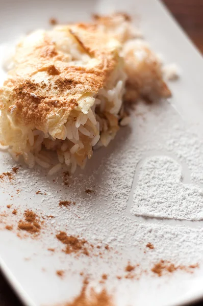 Arroz con leche con canela y compota de manzana Imagen De Stock