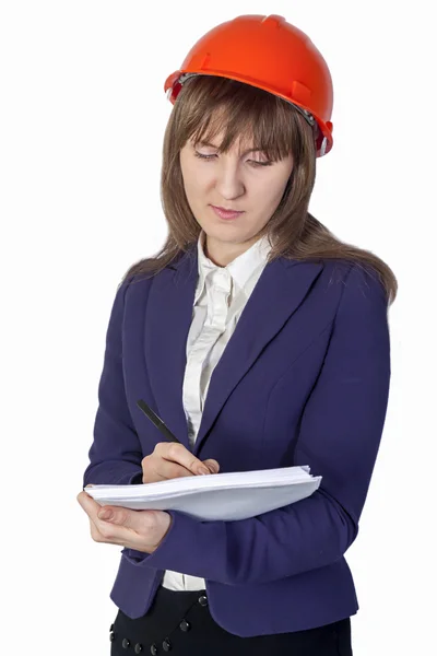 Business woman in suit writing on sheet of paper — Stock Photo, Image