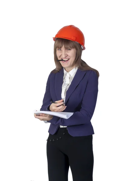 Business woman in a protective helmet holds the pencil mouth — Stock Photo, Image