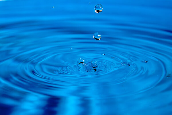 glowing splashes and droplets on surface of water