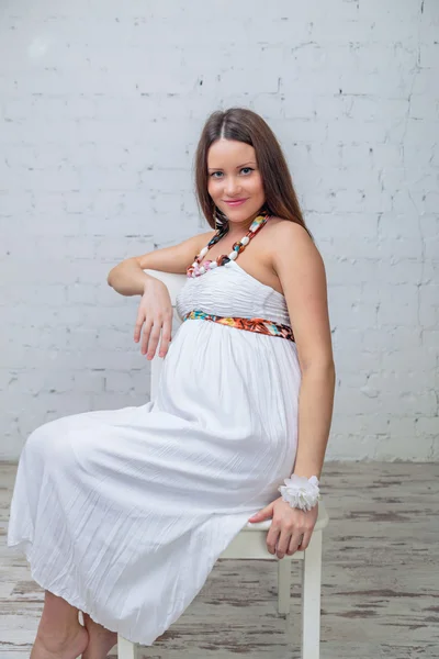 Woman expected a baby on the chair — Stock Photo, Image