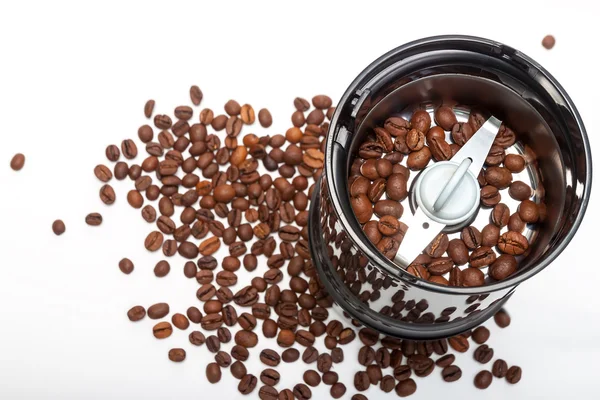 Electric grinder machine with roasted coffee beans — Stock Photo, Image