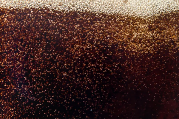 Macro bubble and  foam on the glass wall of cola — Stock Photo, Image