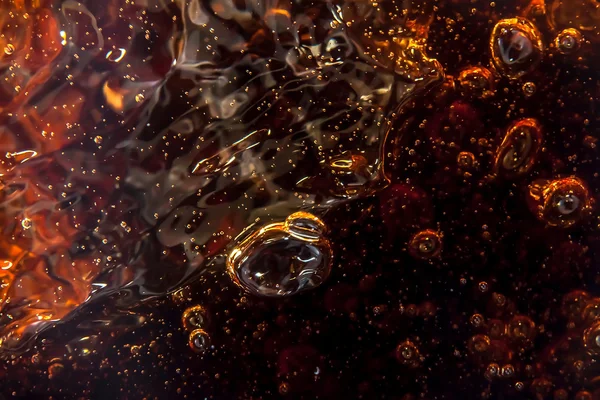 Macro black bubbles  on the glass wall of cola — Stock Photo, Image