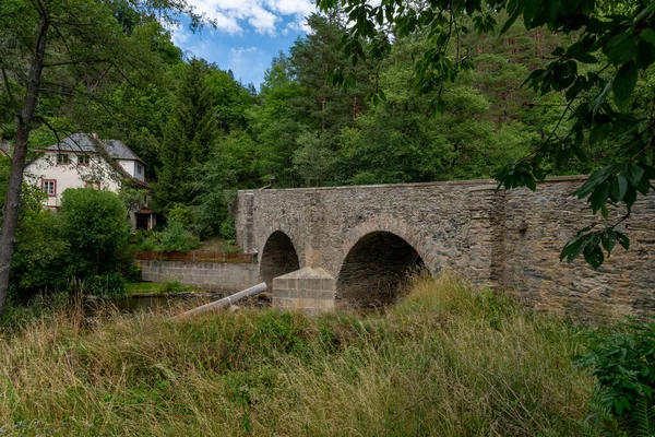 The stone bridge built over the StRela River is a technical monument - Czech smallest historical city Rabstejn nad Strelou