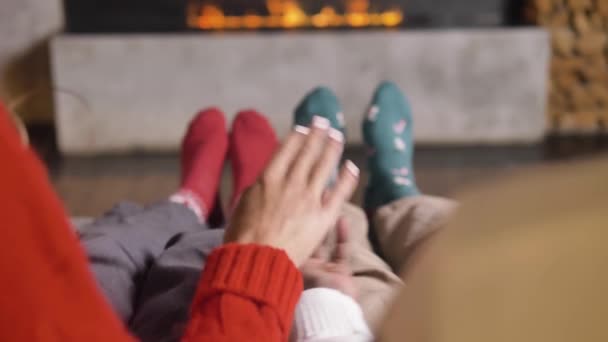 African American woman and man hold hands near fireplace — Stock Video