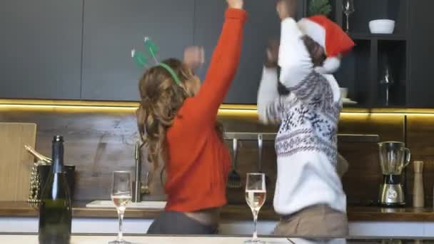 Black couple dances near glasses and bottle of champagne — Stock videók