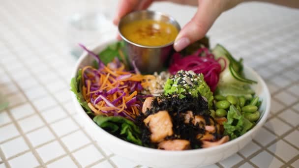 Woman Pours Sauce Delicious Vegetarian Meal Fresh Salad Seafood White — Video